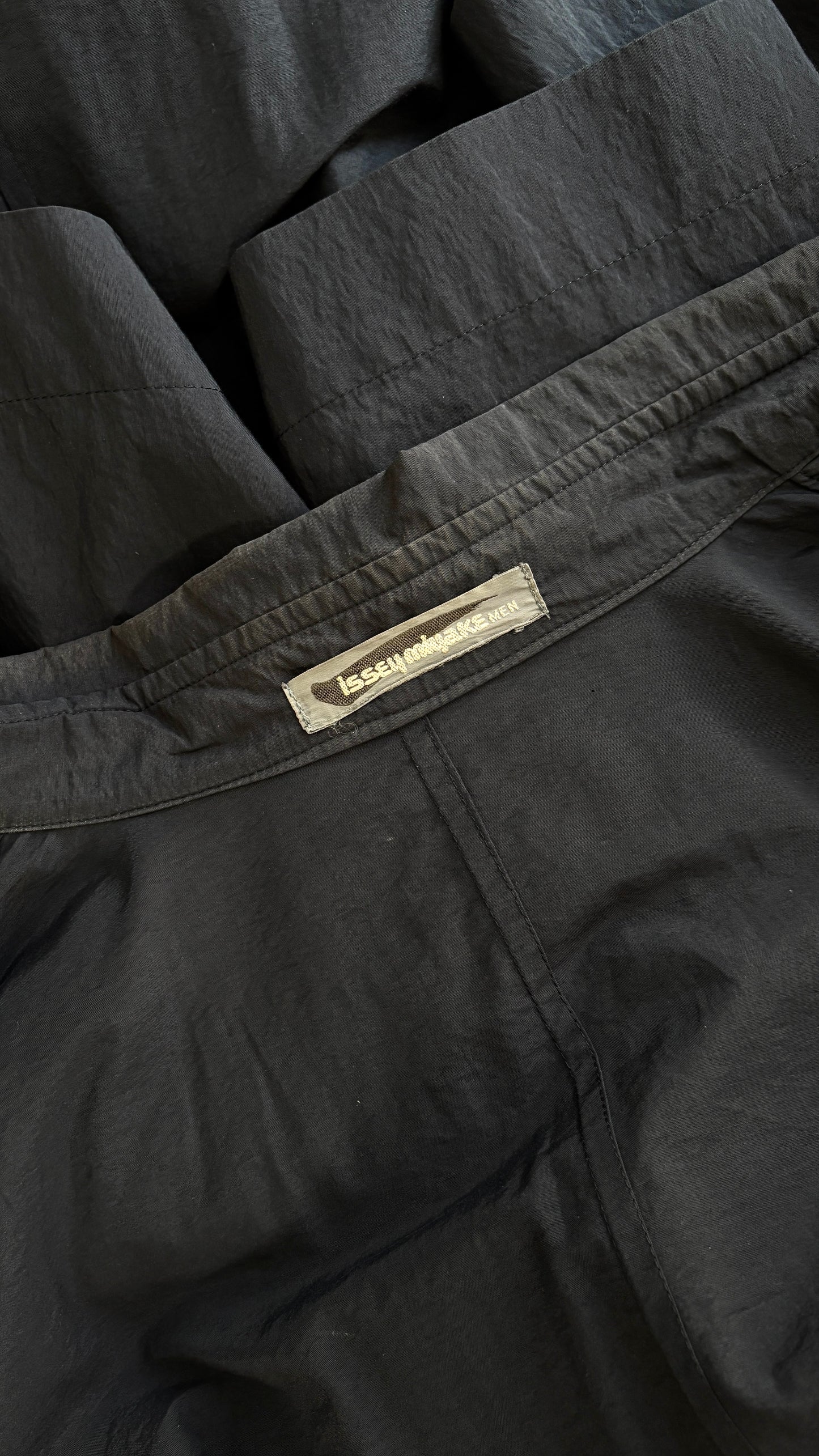 Issey Miyake raincoat with adjustable panels