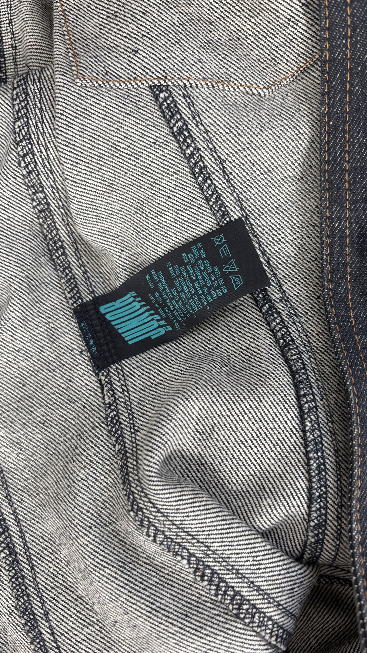 Junior Gaultier sculpted denim jacket with integrated belt