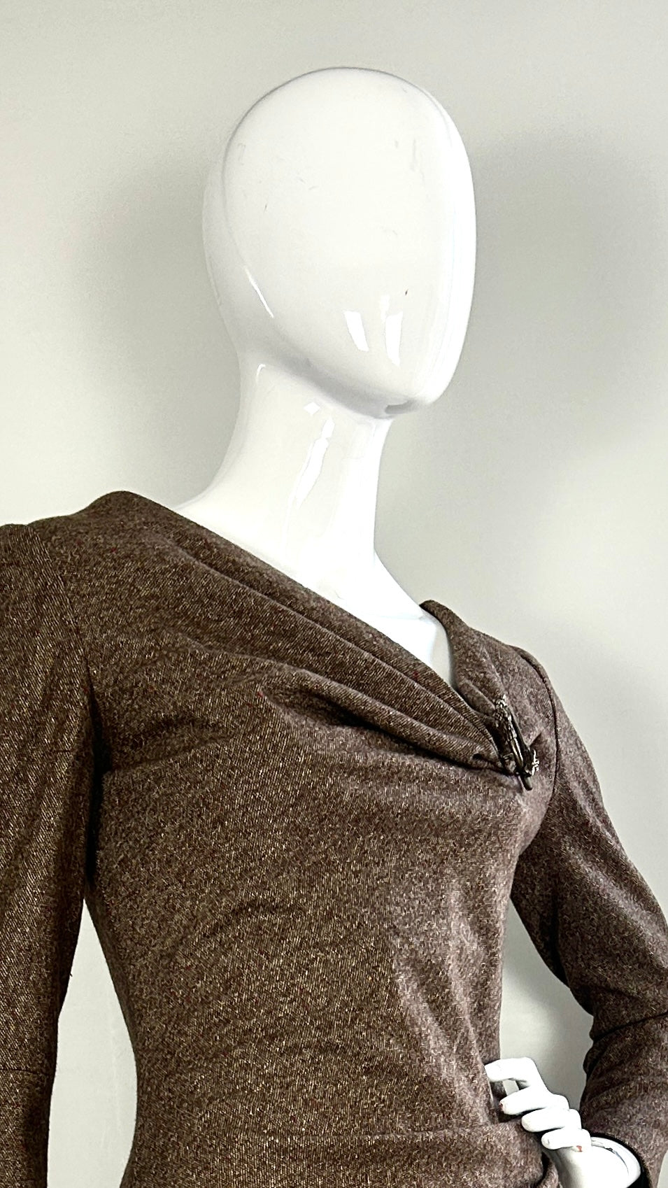 Alexander McQueen A/W 2006 draped tweed dress with wolf broach