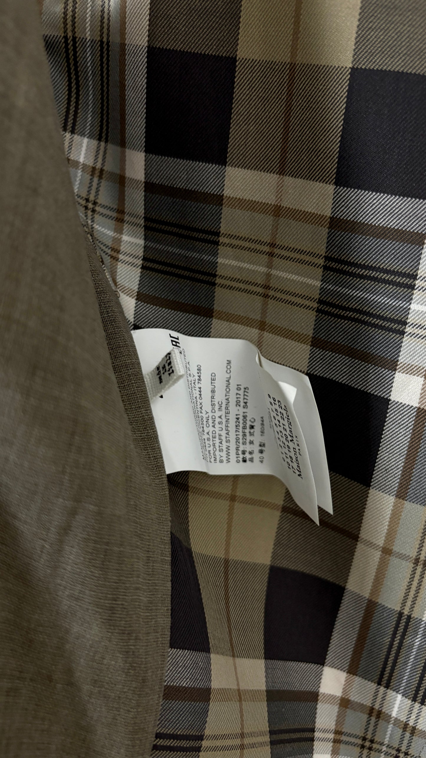 Margiela translucent plaid frock coat.