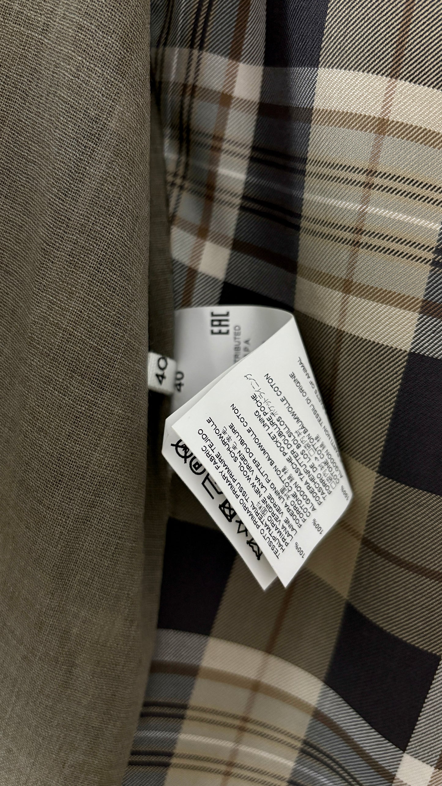 Margiela translucent plaid frock coat.