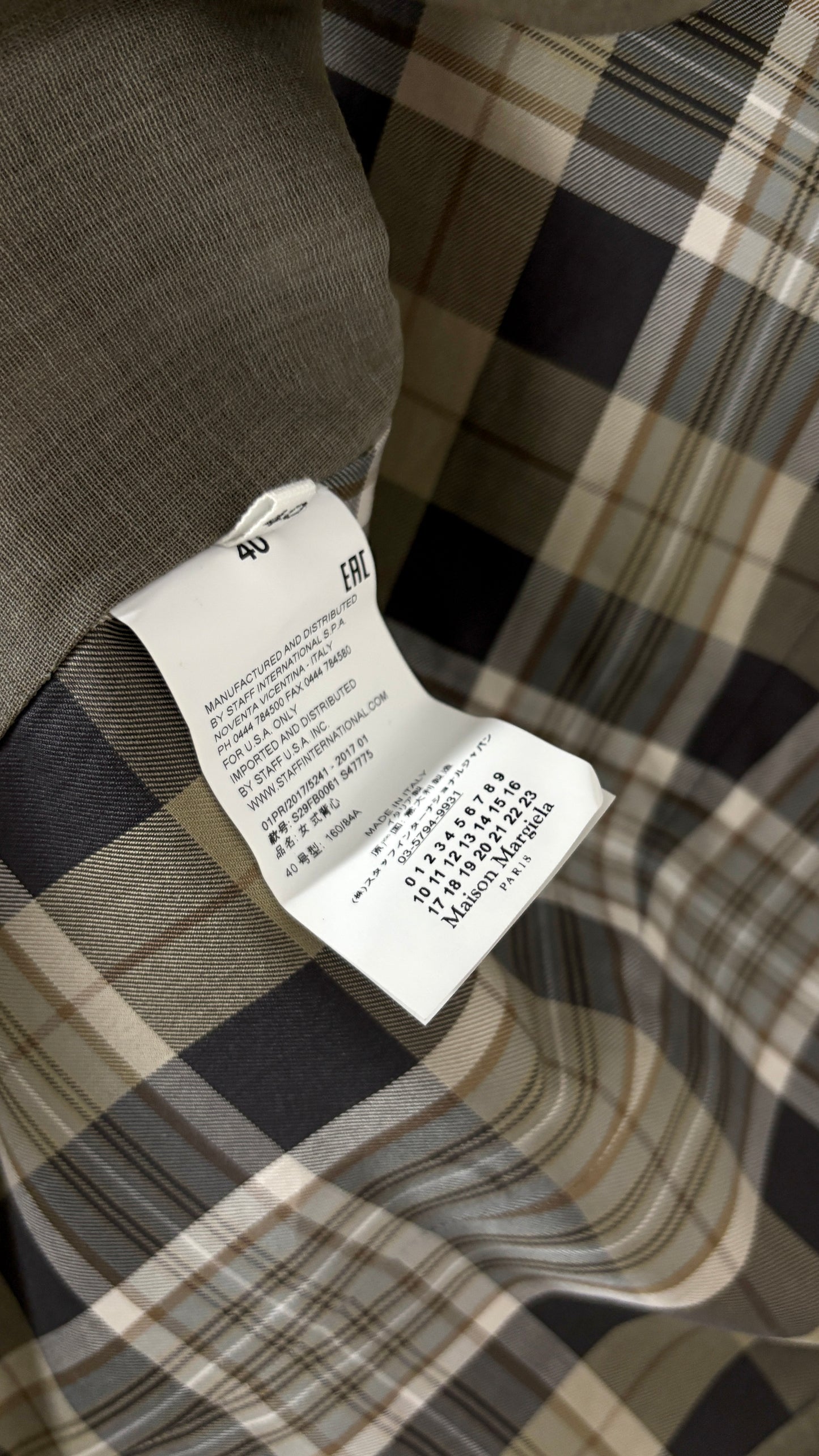 Margiela translucent plaid frock coat.