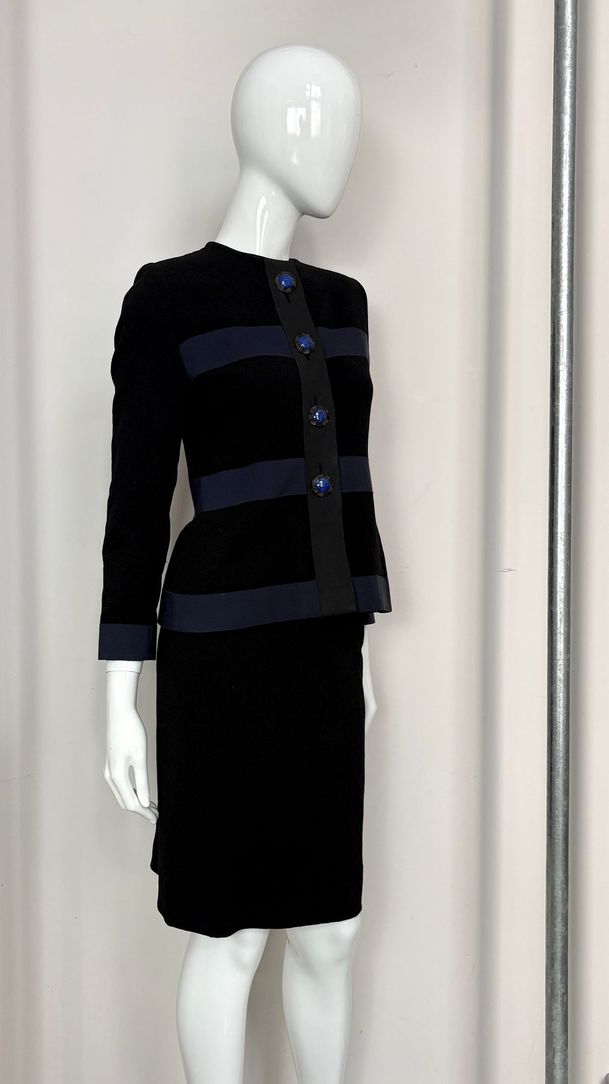 Yves Saint Laurent navy suit with contrast buttons
