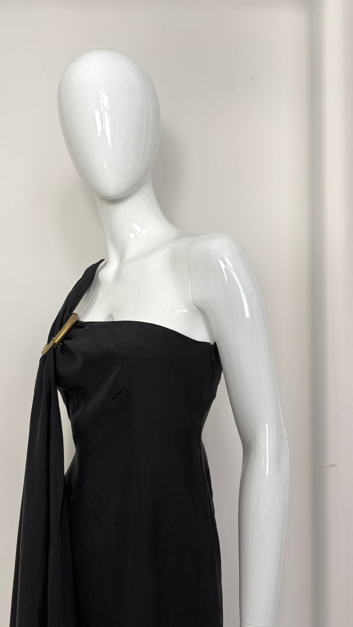 Sybilla draped black gown with gold ring hardware
