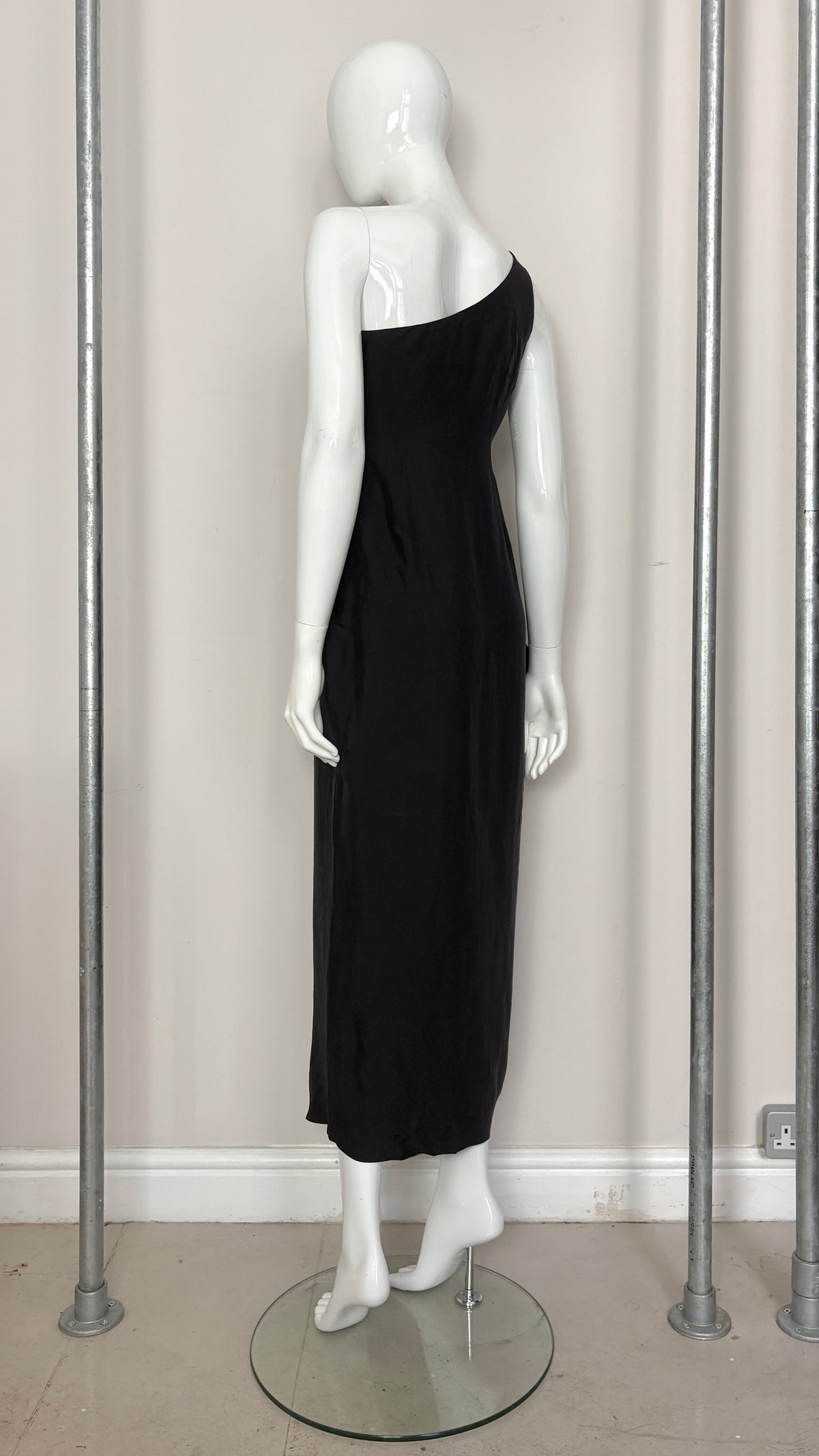 Sybilla draped black gown with gold ring hardware