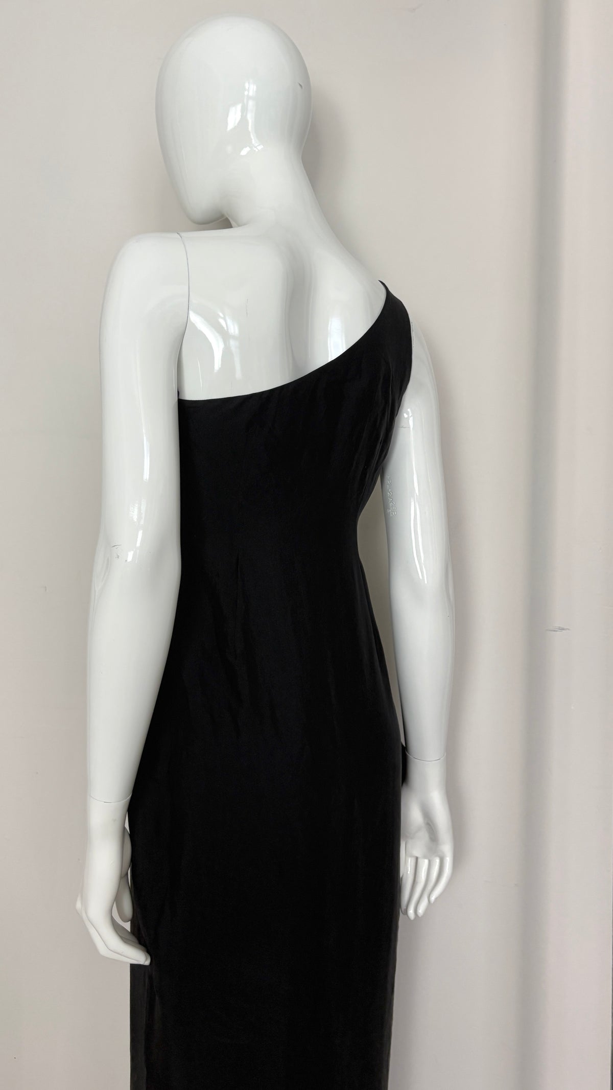 Sybilla draped black gown with gold ring hardware
