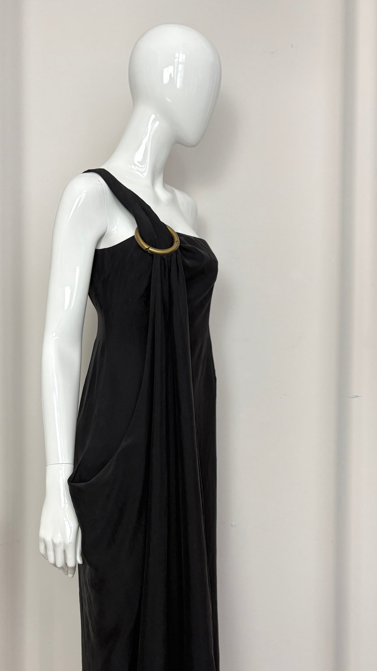 Sybilla draped black gown with gold ring hardware