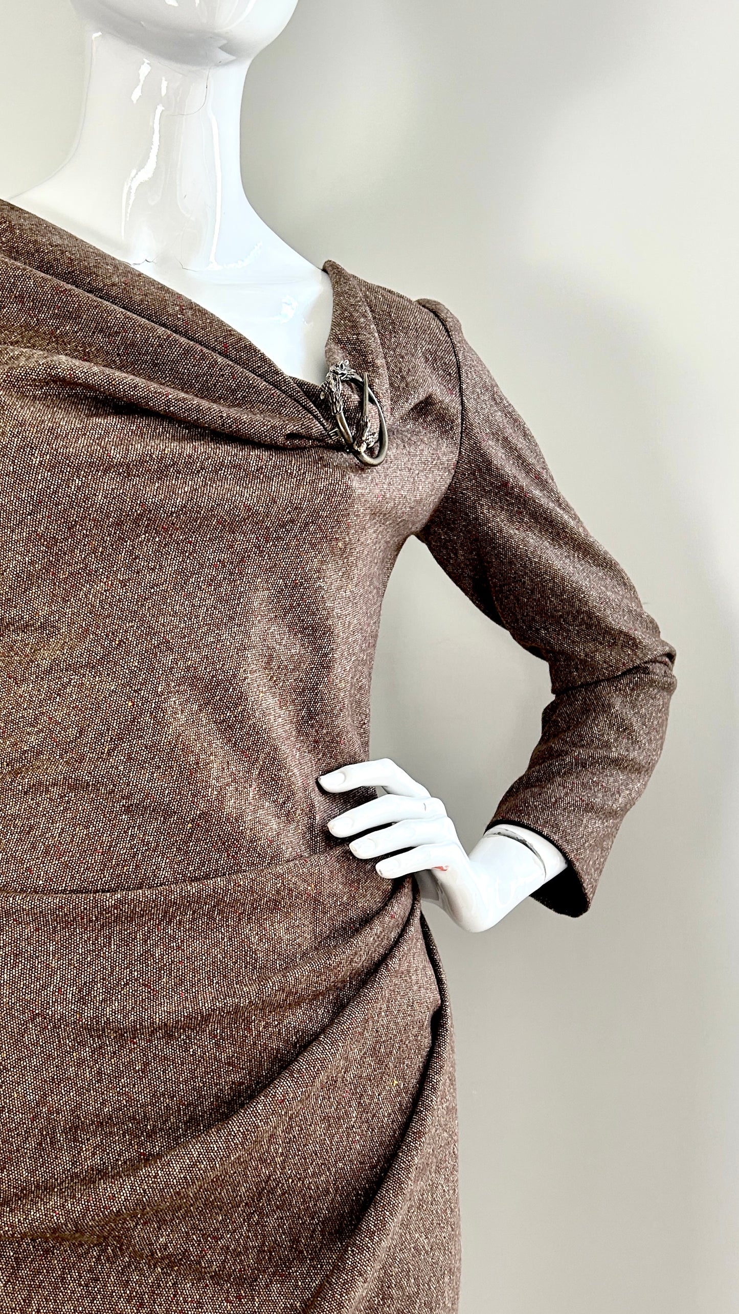 Alexander McQueen A/W 2006 draped tweed dress with wolf broach